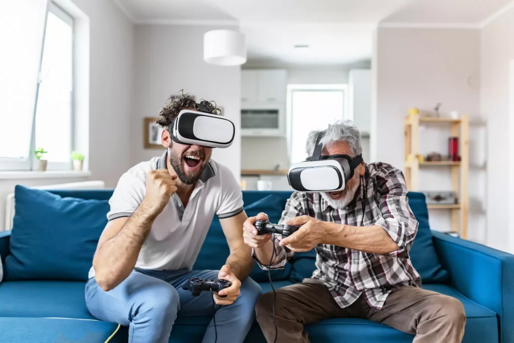 Two people in a blue sofa Playing VR Games