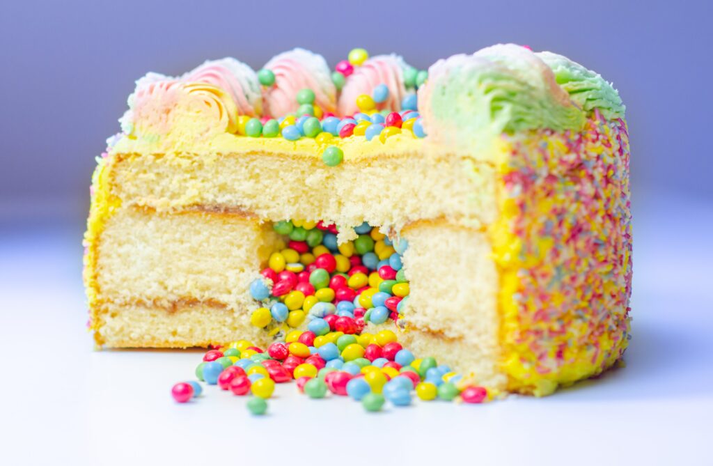 Rainbow Pinata Cake is one of the Tasty Cake Recipes for Your Kid's Birthday