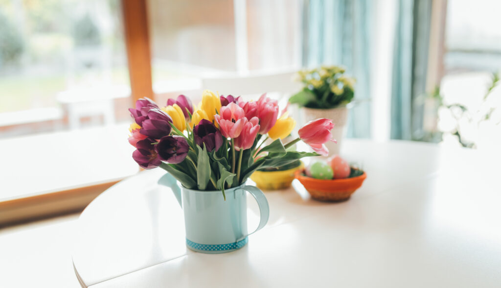 Colourful Tulips in a Jug in a Table