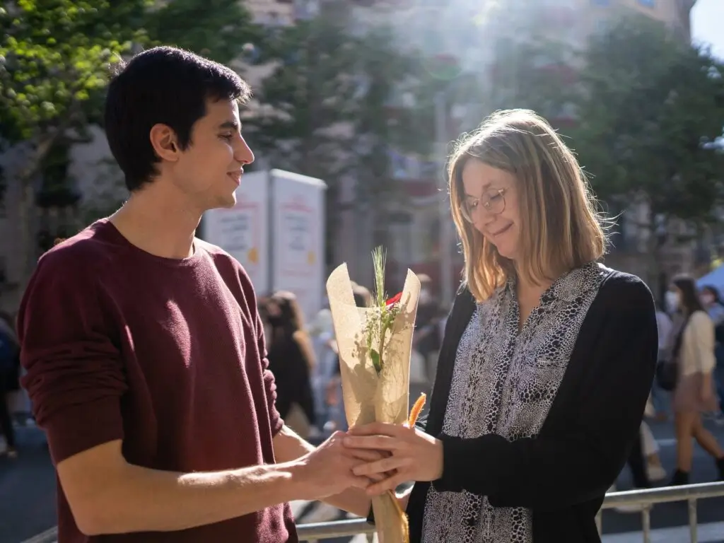 Man Giving Flower Bouquet to a Lady