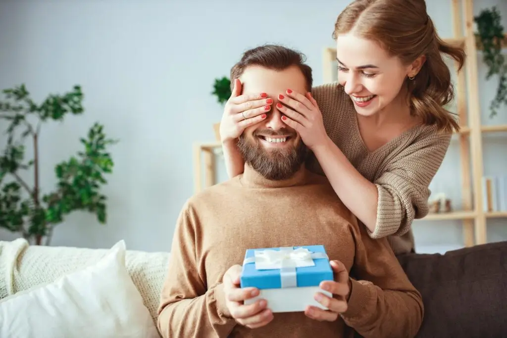 Women Holding a Mans Eyes with a Gift Box