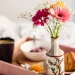 Flowers in a Vase in a tray with tea and snacks